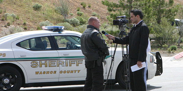 Media interviewing a Reno Officer with a Safety Message